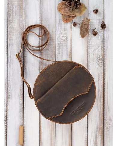 Ruda apvali sendintos odos rankinė